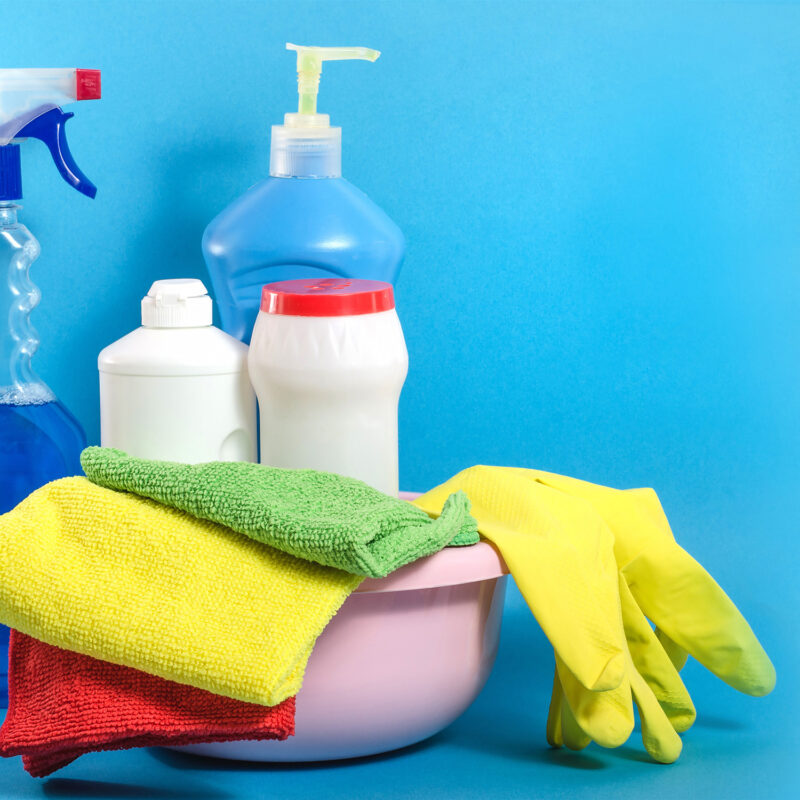 Background banner with home cleaning products with colorful napk